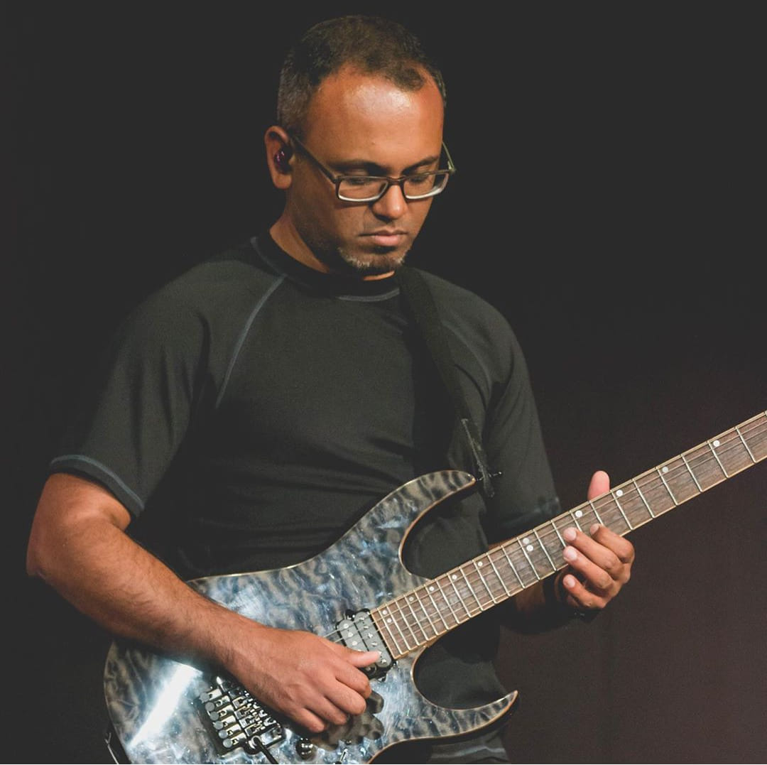 Moncy serving on a church worship team in 2019